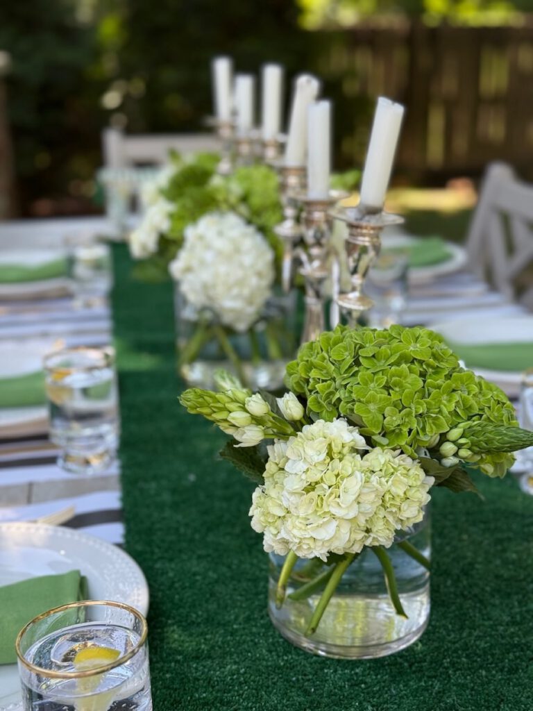 Hydrangea centrepiece on a green and white striped table